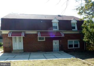 723 Nottingham Road Baltimore, MD 21229 - Photo 24 of 27 a front view of a house with yard