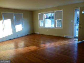723 Nottingham Road Baltimore, MD 21229 - Photo 8 of 27 a view of empty room with wooden floor and fan
