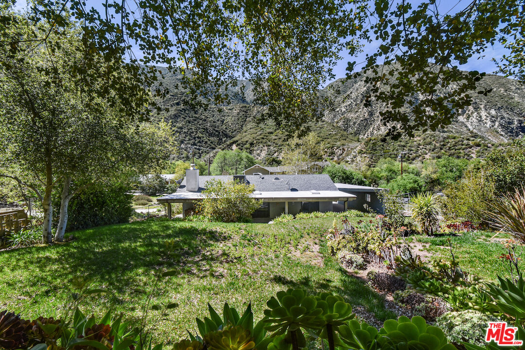 2447 Stonyvale Road Tujunga, CA 91042 - Photo 25 of 33 a view of a house with a yard