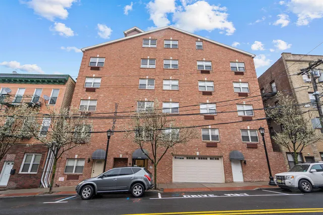 an aerial view of houses with yard