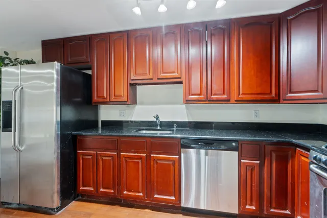a view of hallway with washer and dryer