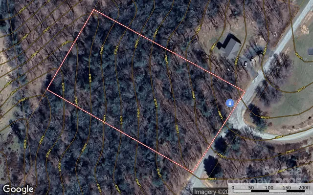 a black and white building with trees in the background