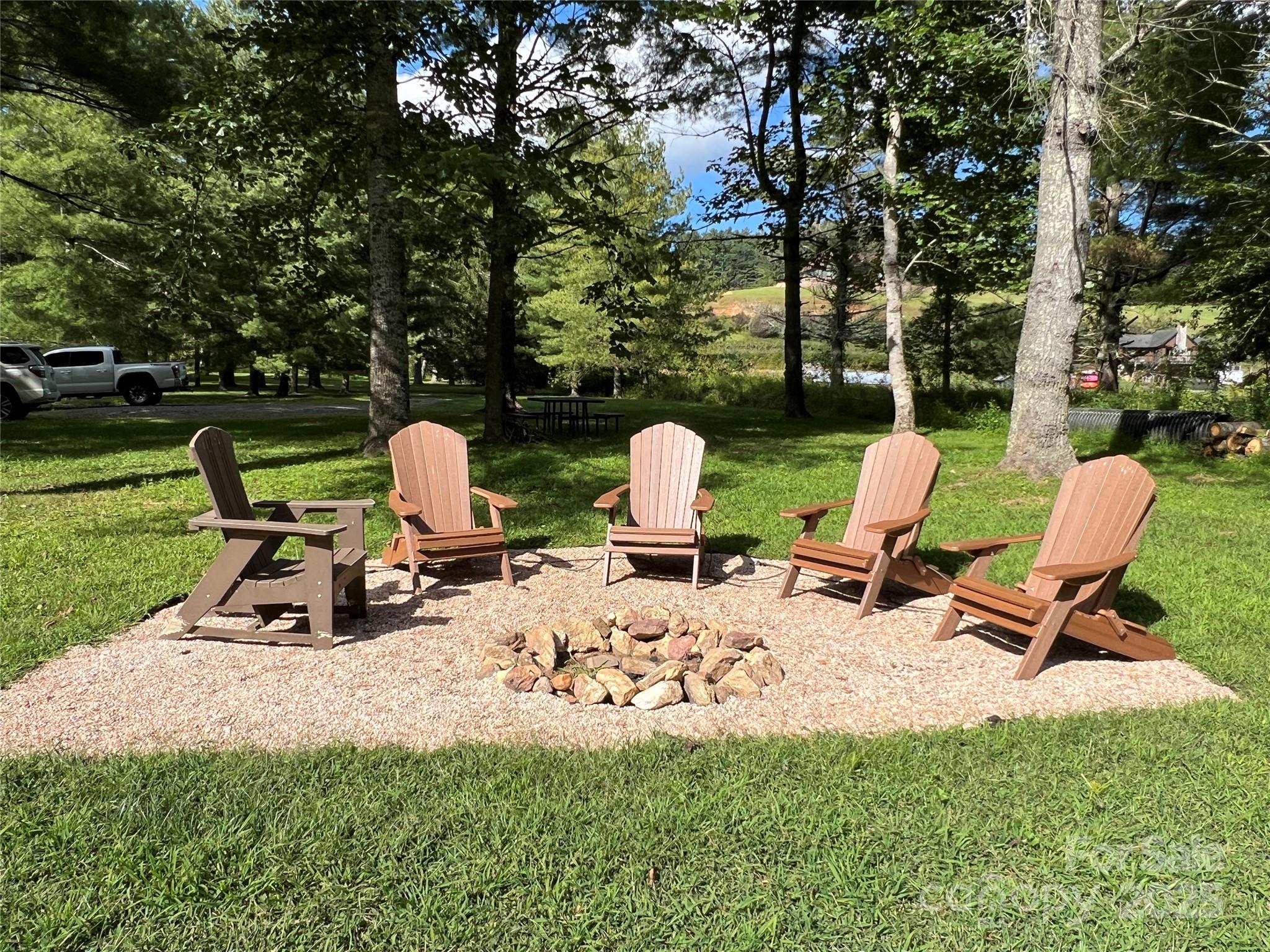 34 Fox Crest, Unit NONE Laurel Springs, NC 28644 - Photo 21 of 22 a view of a two chairs in a yard
