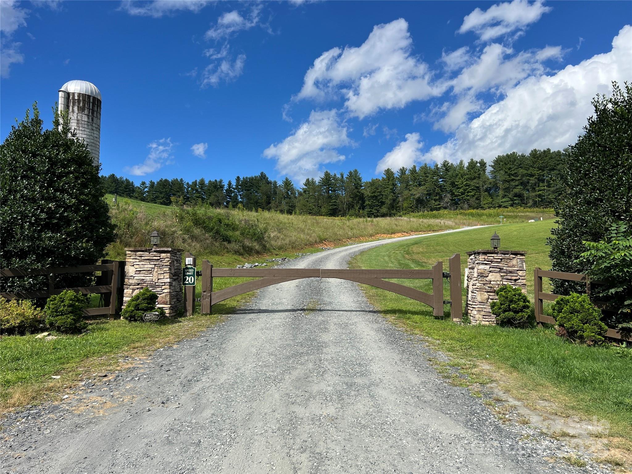 34 Fox Crest, Unit NONE Laurel Springs, NC 28644 - Photo 4 of 22 a view of a lake with a yard
