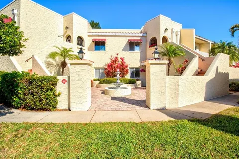 a view of a house with fountain