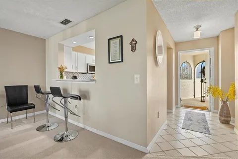 a kitchen with sink cabinets and refrigerator