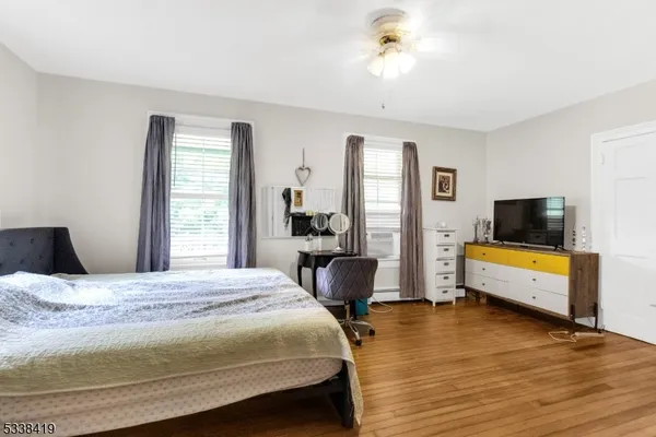 a bedroom with a bed and a view of bedroom