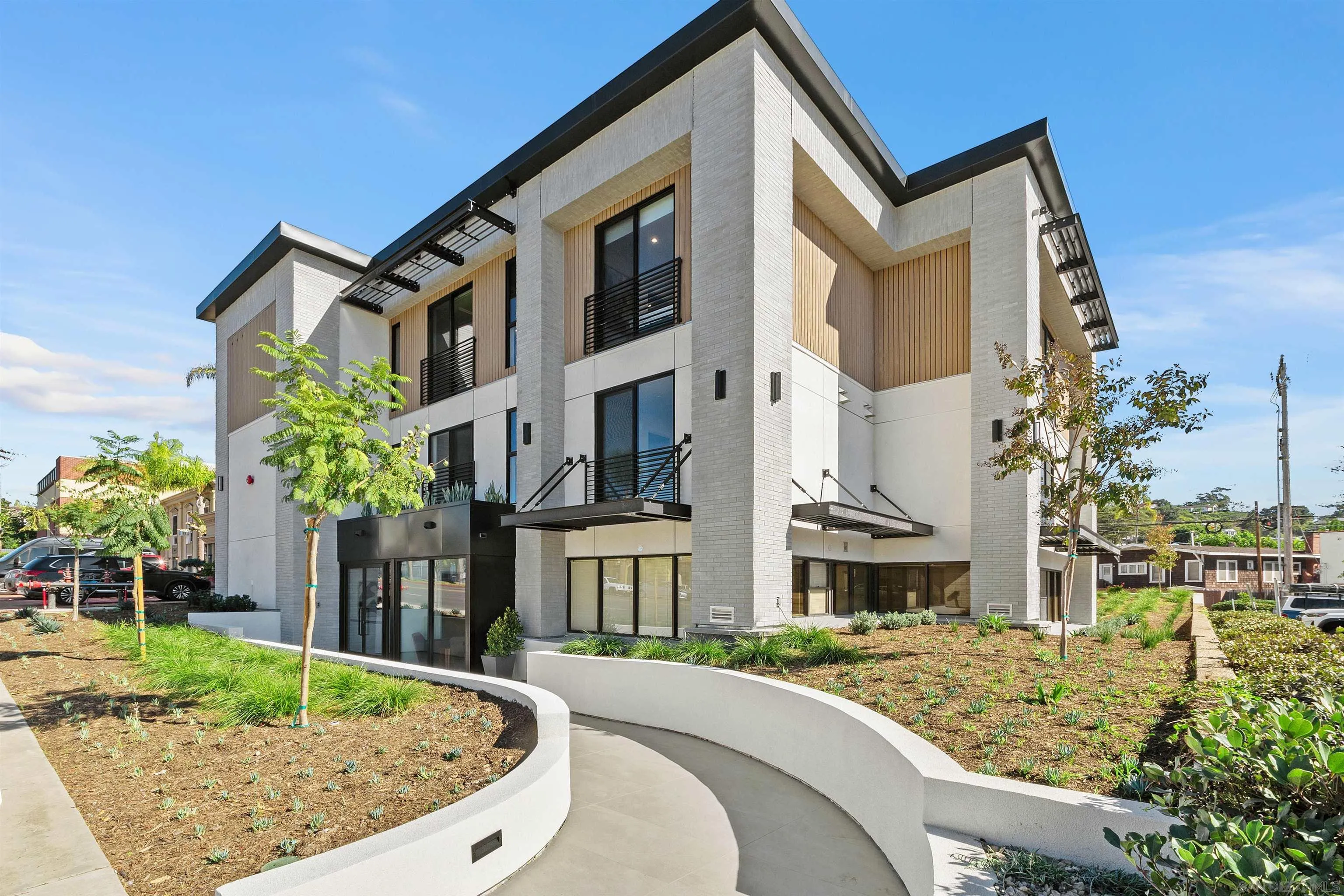 1111 Torrey Pines Road, Unit 203 La Jolla, CA 92037 - Photo 1 of 10 a front view of a house with a yard
