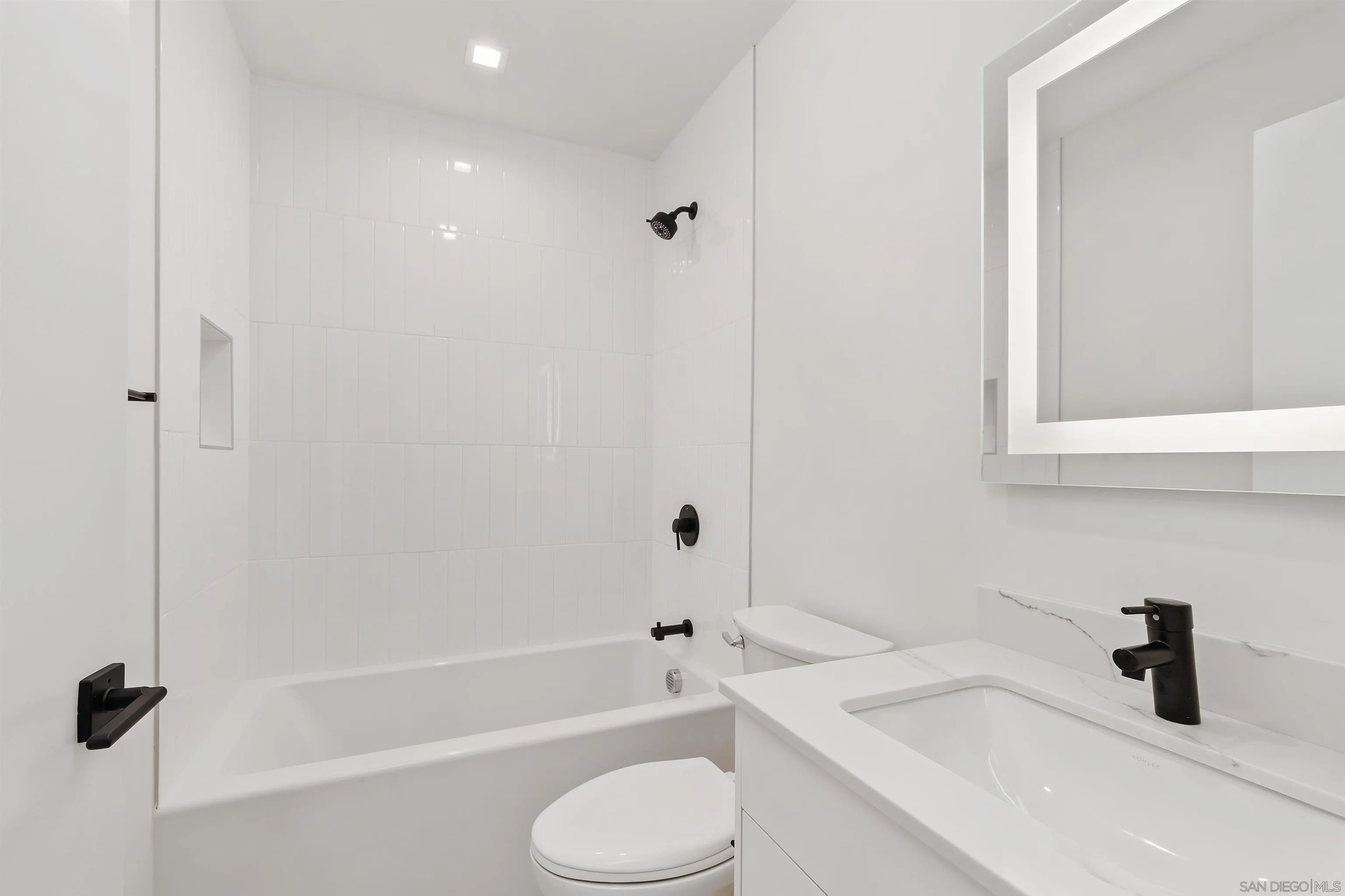 1111 Torrey Pines Road, Unit 203 La Jolla, CA 92037 - Photo 8 of 10 a bathroom with a sink toilet and shower