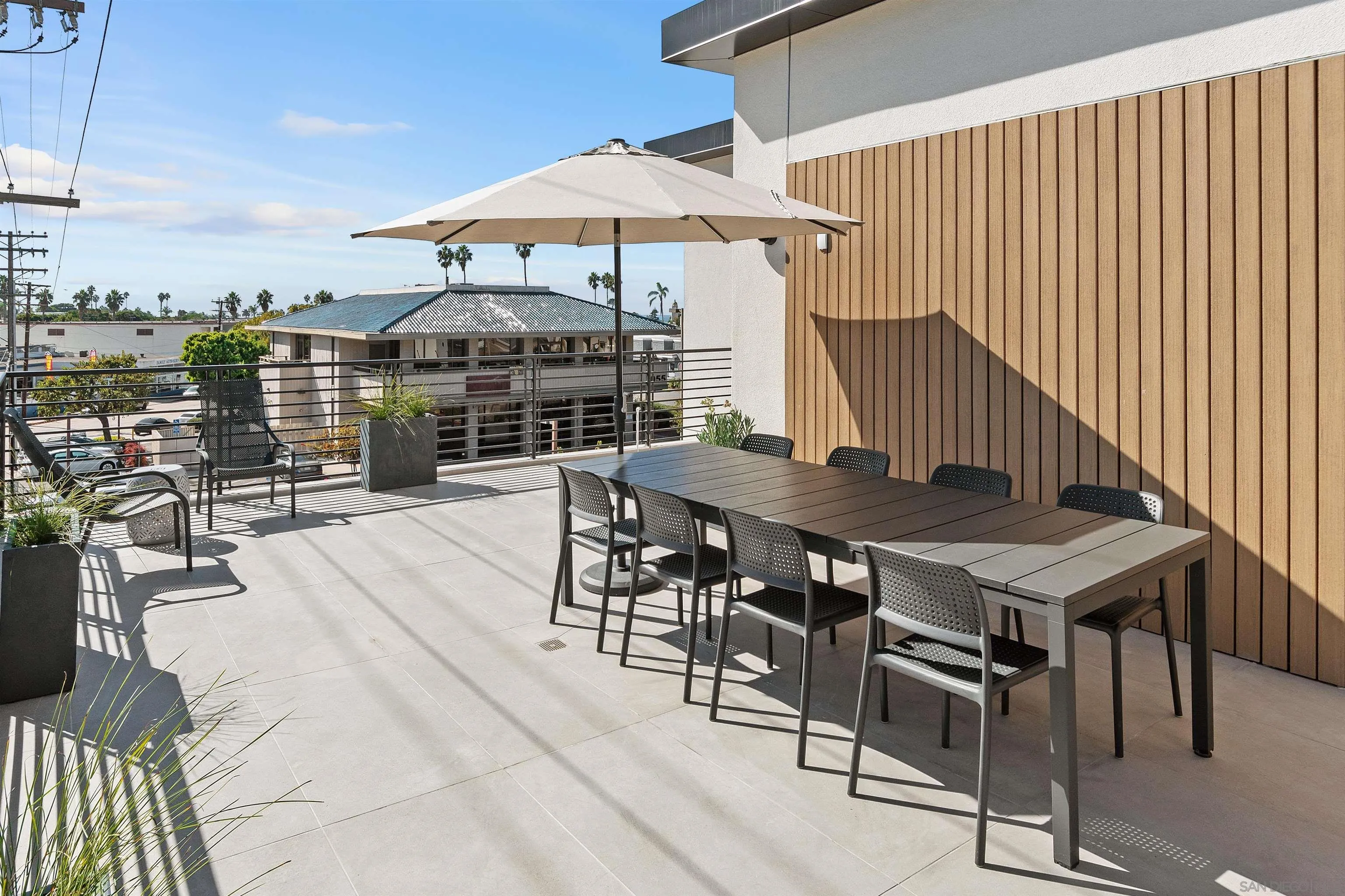 1111 Torrey Pines Road, Unit 203 La Jolla, CA 92037 - Photo 9 of 10 a terrace with a table and chairs