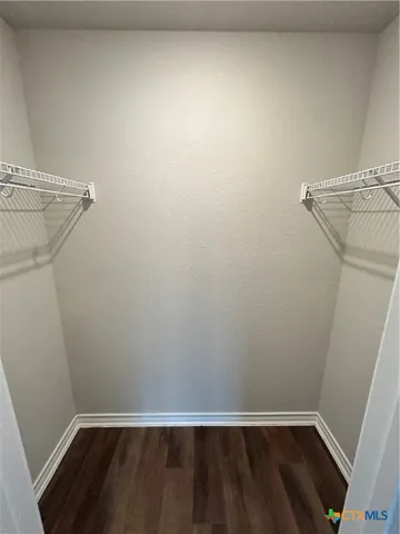 a view of a room with wooden floor and utility