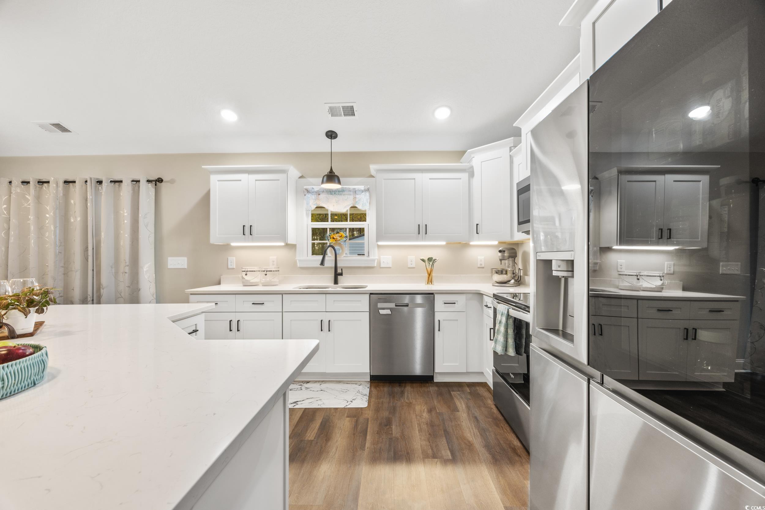 3390 Dusty Road Loris, SC 29569 - Photo 13 of 33 Kitchen with white cabinetry, stainless steel appl