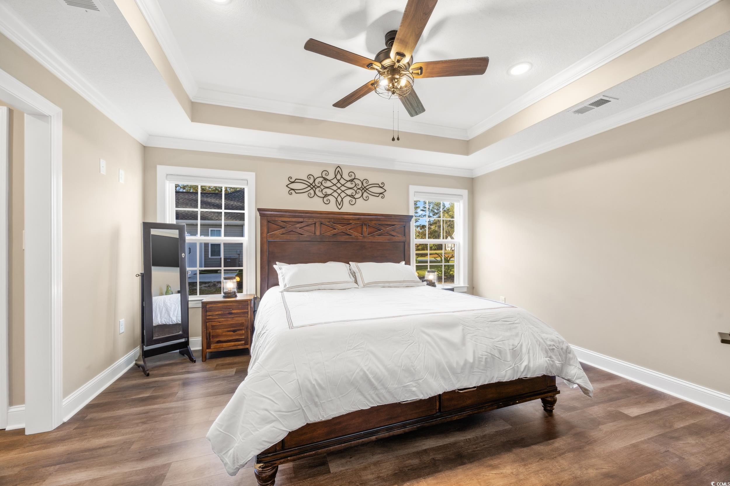3390 Dusty Road Loris, SC 29569 - Photo 14 of 33 Bedroom with crown molding, dark hardwood / wood-s