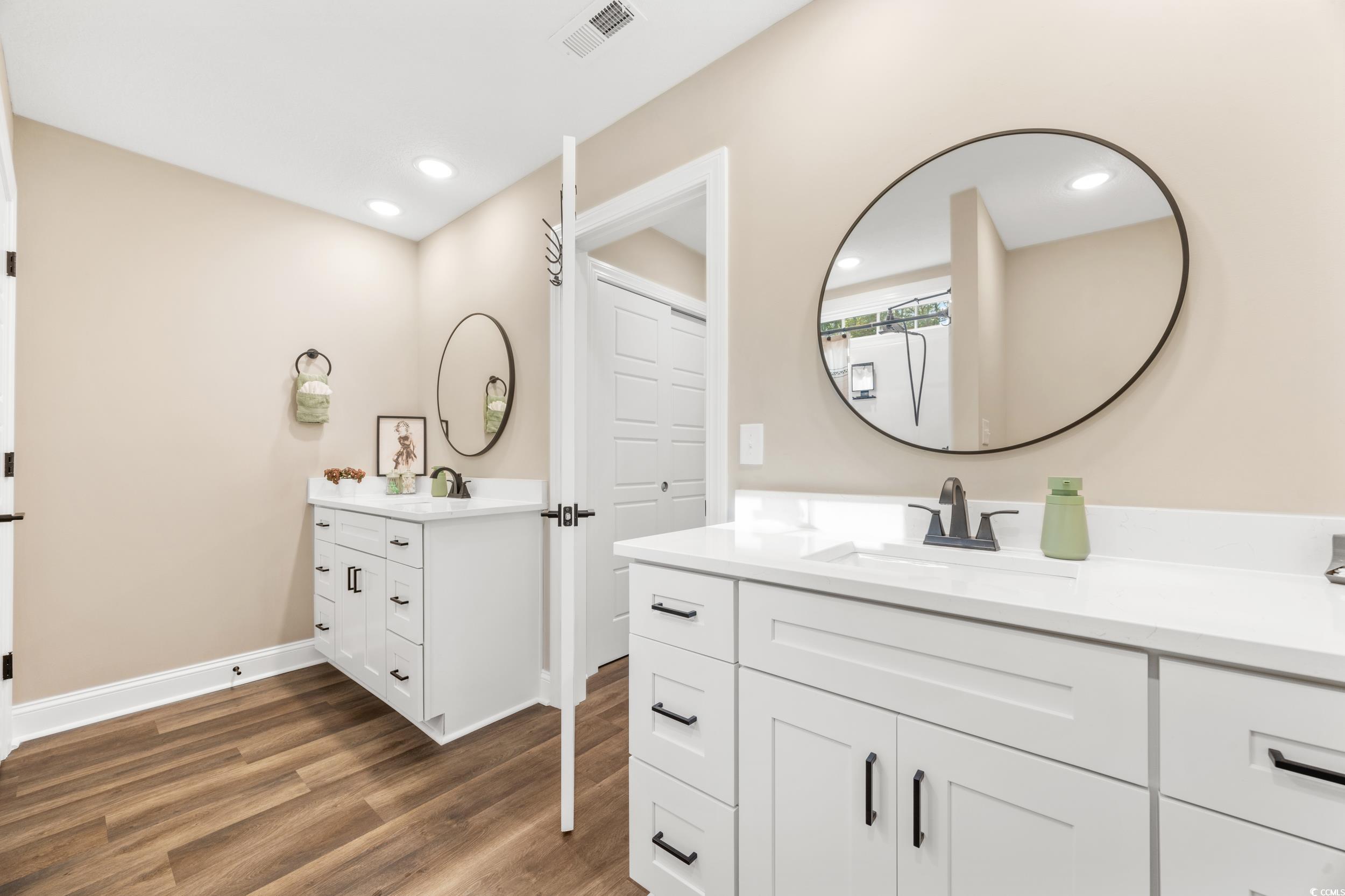 3390 Dusty Road Loris, SC 29569 - Photo 17 of 33 Bathroom featuring vanity and hardwood / wood-styl