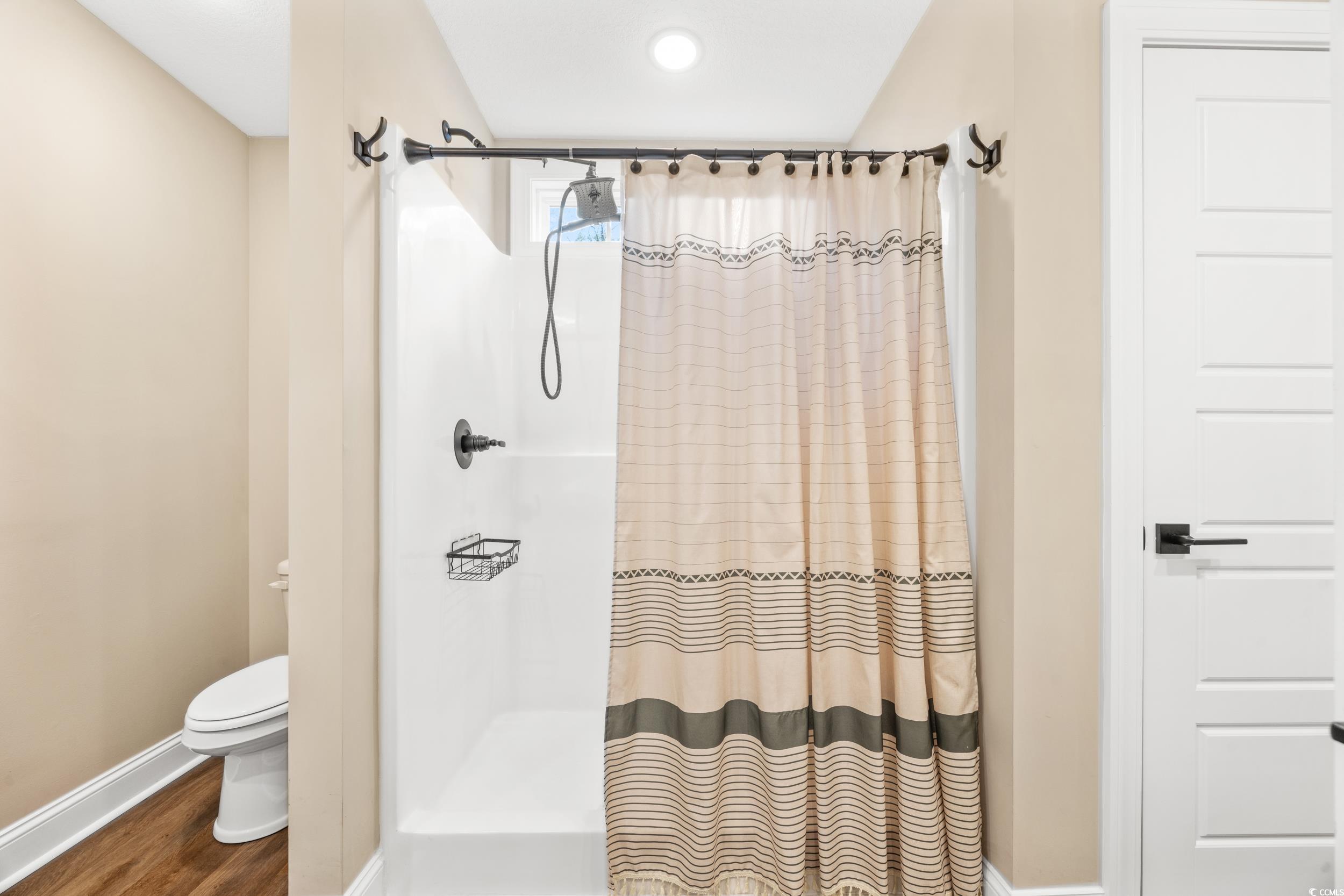 3390 Dusty Road Loris, SC 29569 - Photo 18 of 33 Bathroom featuring toilet, walk in shower, and woo