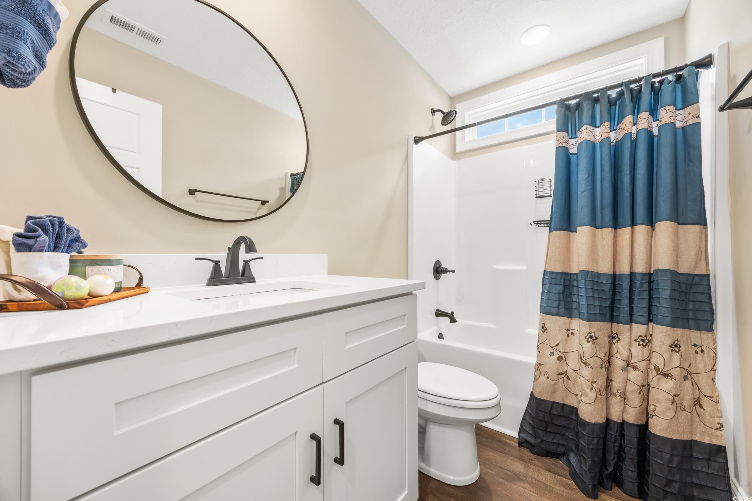 3390 Dusty Road Loris, SC 29569 - Photo 23 of 33 Full bathroom featuring vanity, hardwood / wood-st