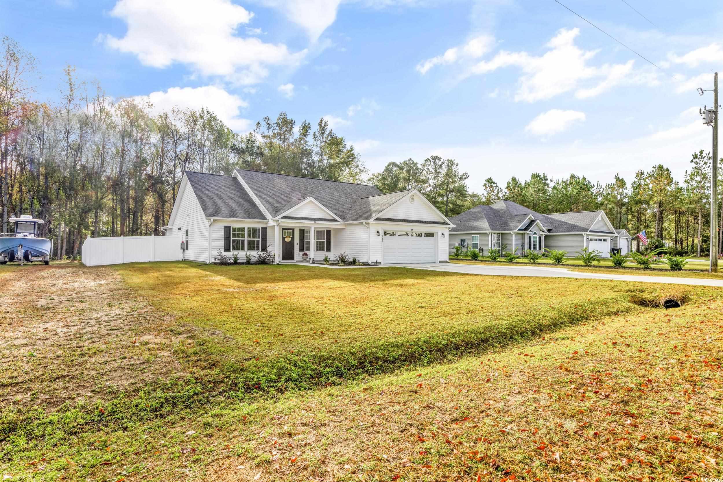 3390 Dusty Road Loris, SC 29569 - Photo 3 of 33 Ranch-style home featuring a front lawn and a gara