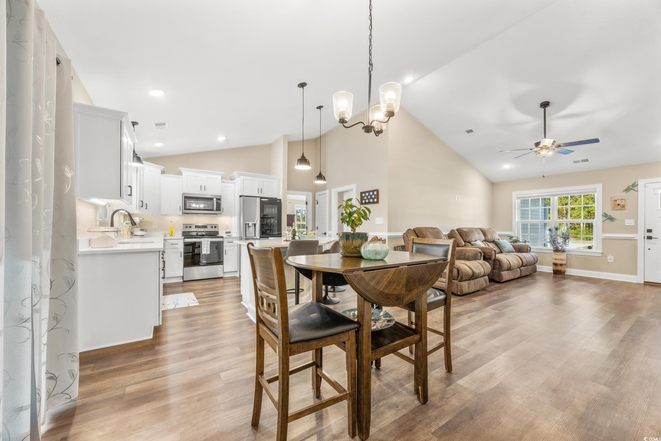 3390 Dusty Road Loris, SC 29569 - Photo 9 of 33 Dining area featuring high vaulted ceiling, sink,