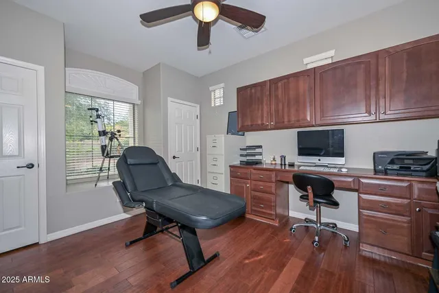 a large bathroom with a large tub sink vanity and granite
