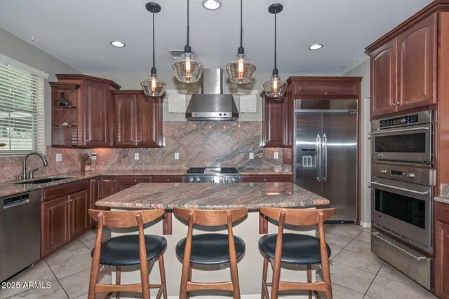 a living room with lots of furniture and a chandelier