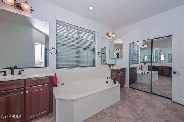 a view of a porch with furniture and a yard