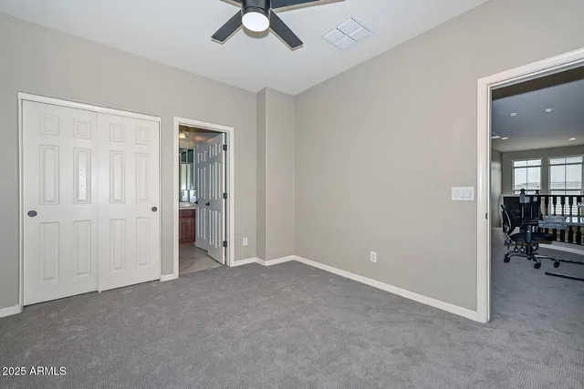 a view of a swimming pool with a garden and trees