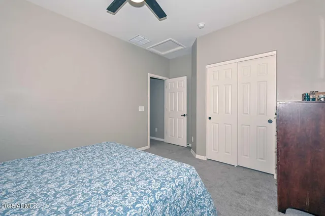 a view of a lake with a bench and trees around