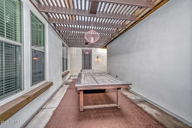 a front view of a house with a garden and plants