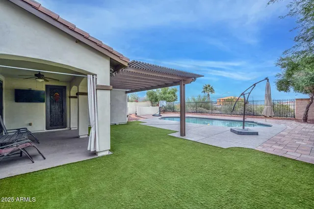 a view of a street with a bench and trees around