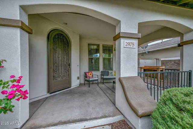 a kitchen with stainless steel appliances granite countertop a sink a stove and a wooden cabinets