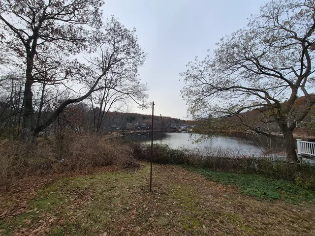 a view of a backyard of the house