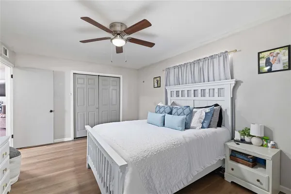 a bedroom with a bed and a window