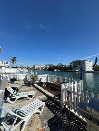 a view of a balcony with two chairs