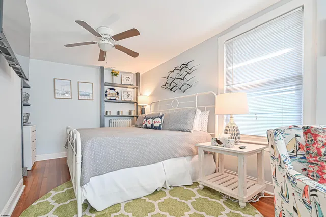 a living room with a couch and wooden floor