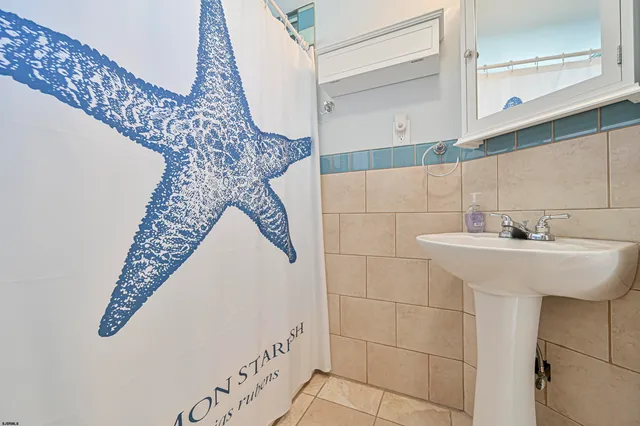 a bathroom with a sink and mirror