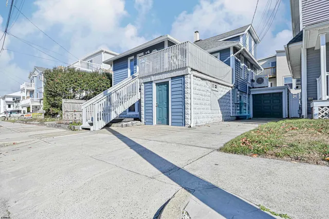 a view of a house with a street