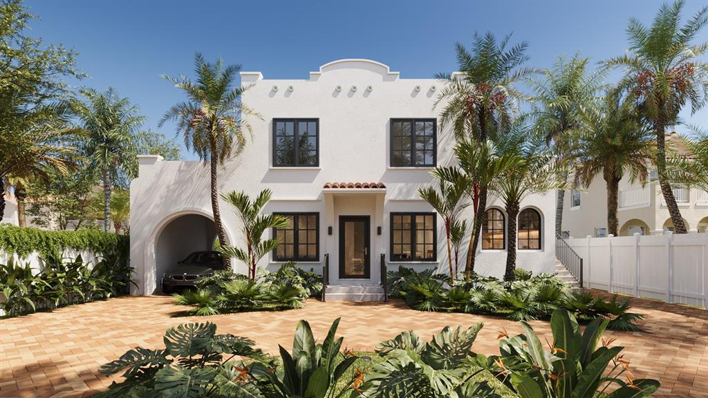 a front view of a house with a garden