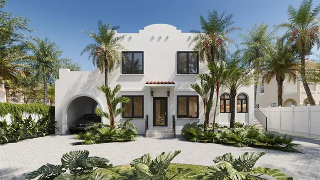 a front view of a house with a garden