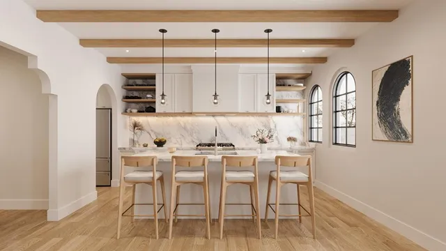 a kitchen with stainless steel appliances kitchen island granite countertop a table and chairs