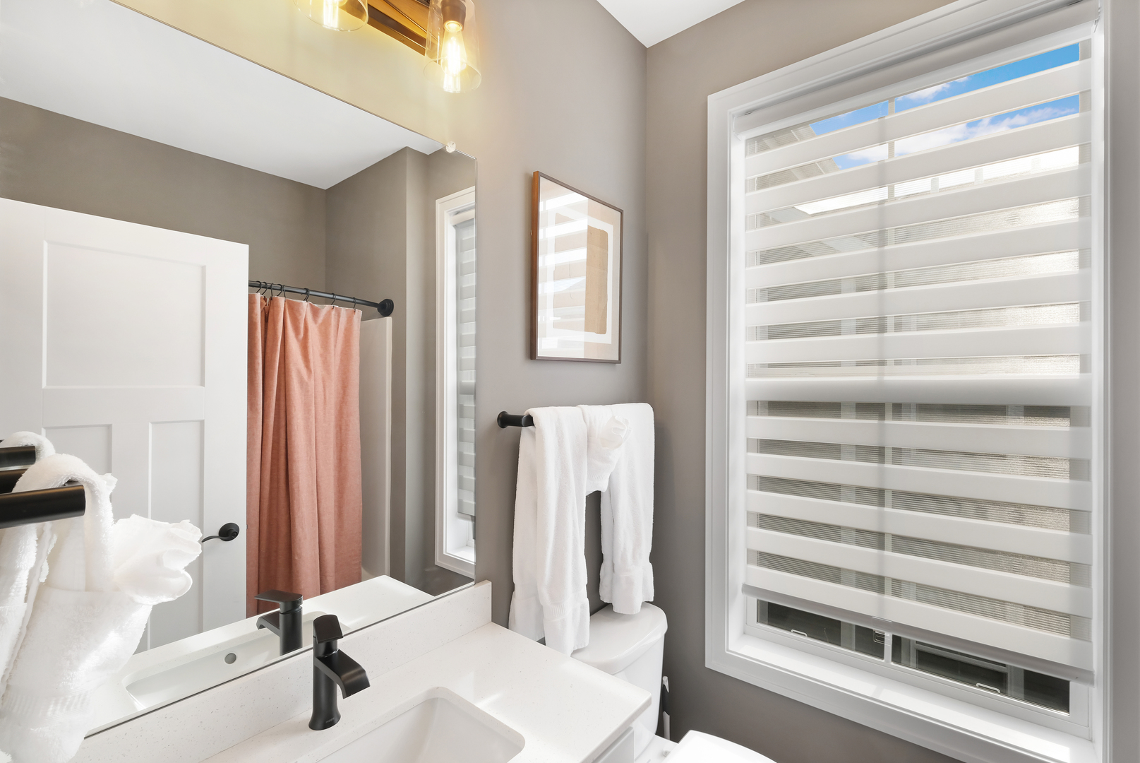 214 Great Lp Drive, Unit 2A Ottawa, IL 61350 - Photo 10 of 10 a bathroom with a sink a mirror and a shower