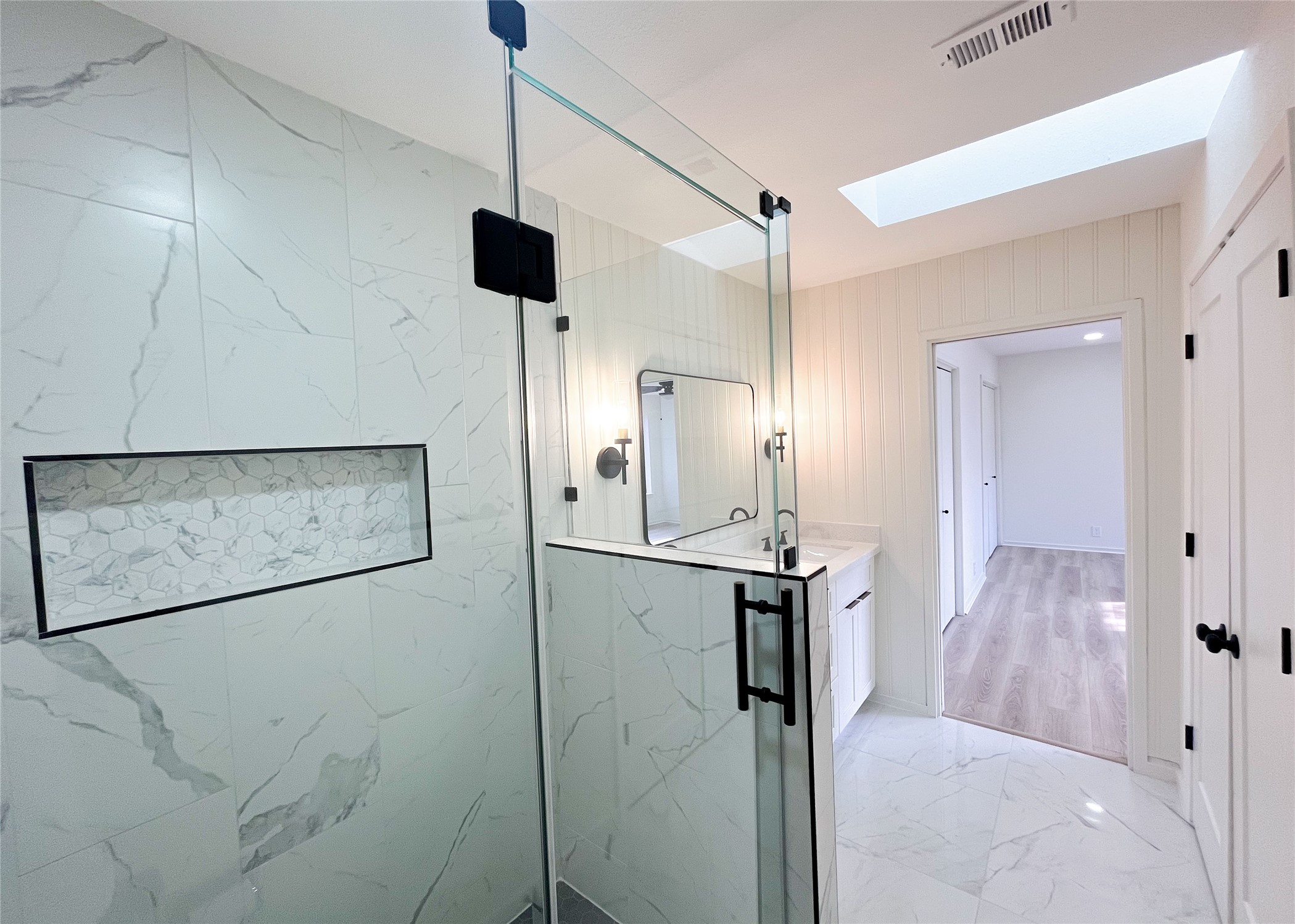 238 Litchfield Lane Houston, TX 77024 - Photo 15 of 25 Elegant frameless glass shower adds a modern touch.