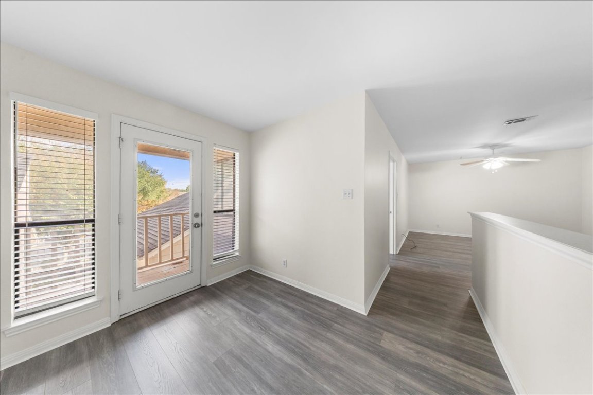 10900 Crown Colony Drive, Unit B Austin, TX 78747 - Photo 19 of 26 a view of entryway with wooden floor