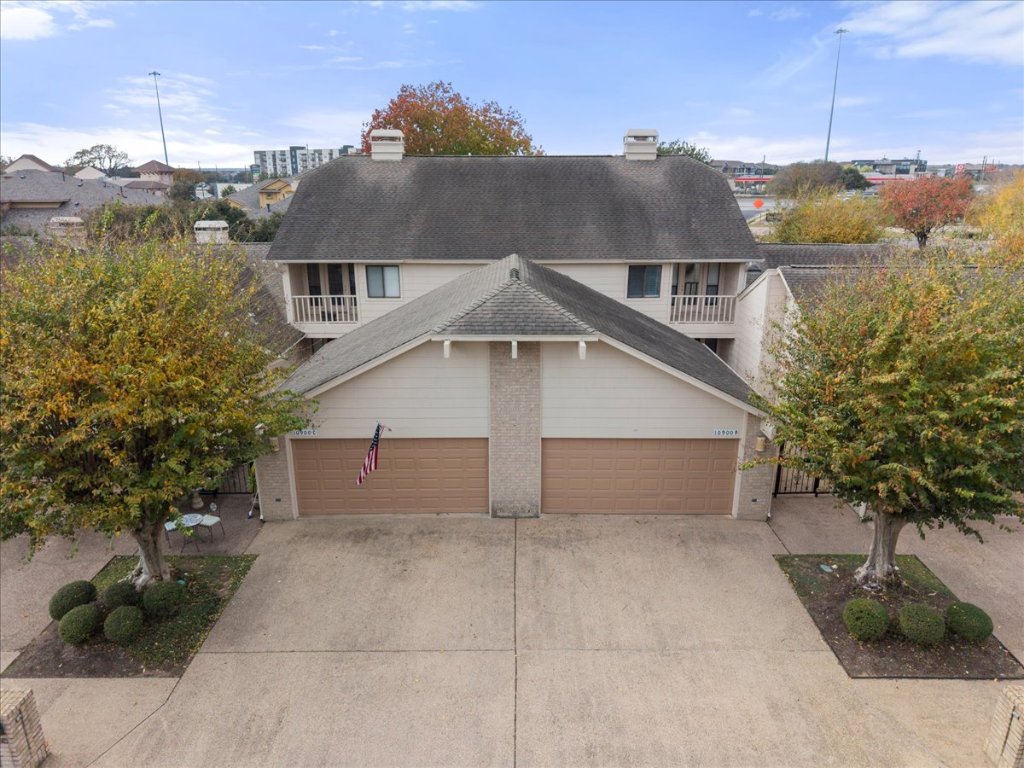 10900 Crown Colony Drive, Unit B Austin, TX 78747 - Photo 2 of 26 a house view with a outdoor space