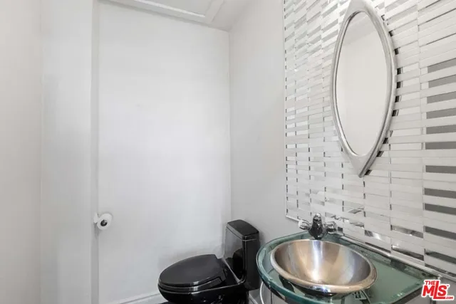 an empty room with wooden floor and fireplace