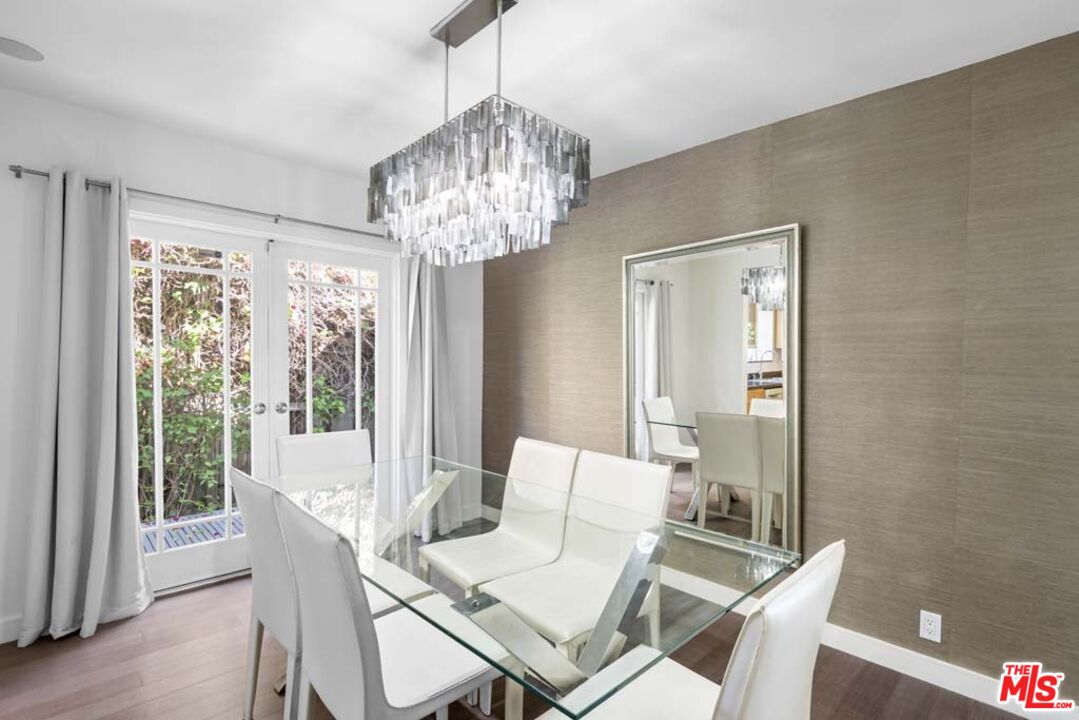 10453 Holman Avenue Los Angeles, CA 90024 - Photo 15 of 67 a view of a dining room with furniture wooden floor and chandelier