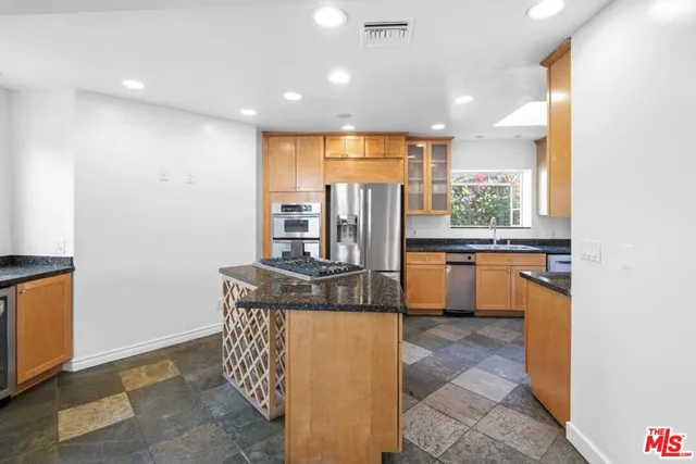 a bathroom with a sink toilet a mirror and shower