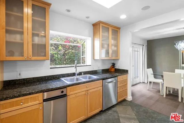 a view of staircase with white walls and railing