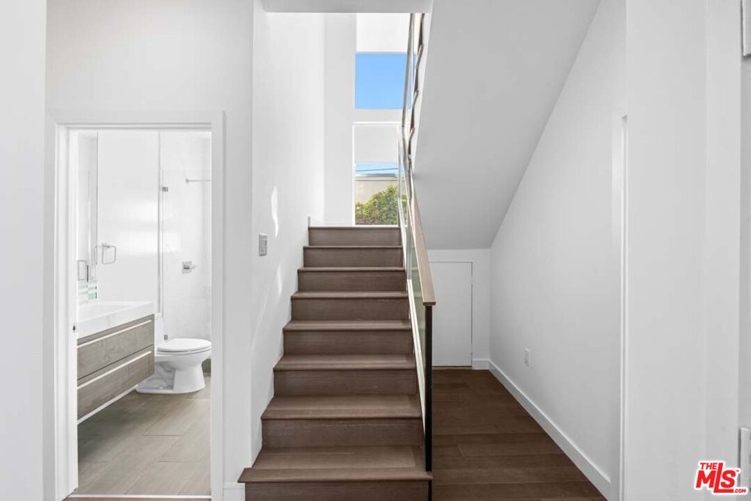 10453 Holman Avenue Los Angeles, CA 90024 - Photo 27 of 67 a view of a hallway with wooden floor and entryway