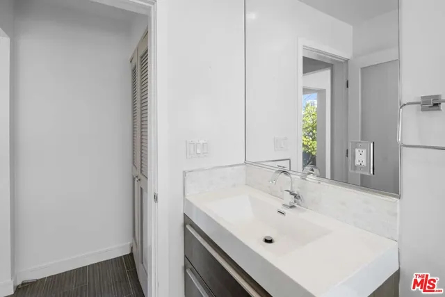 a white bath tub sitting next to a white sink