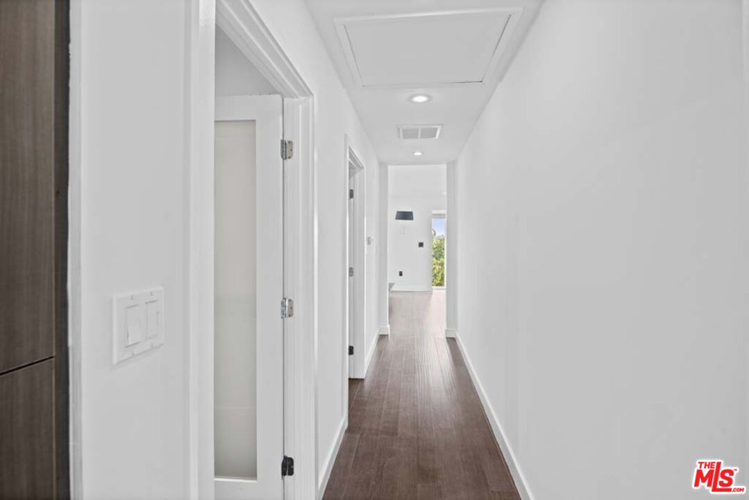10453 Holman Avenue Los Angeles, CA 90024 - Photo 43 of 67 a view of a hallway with wooden floor